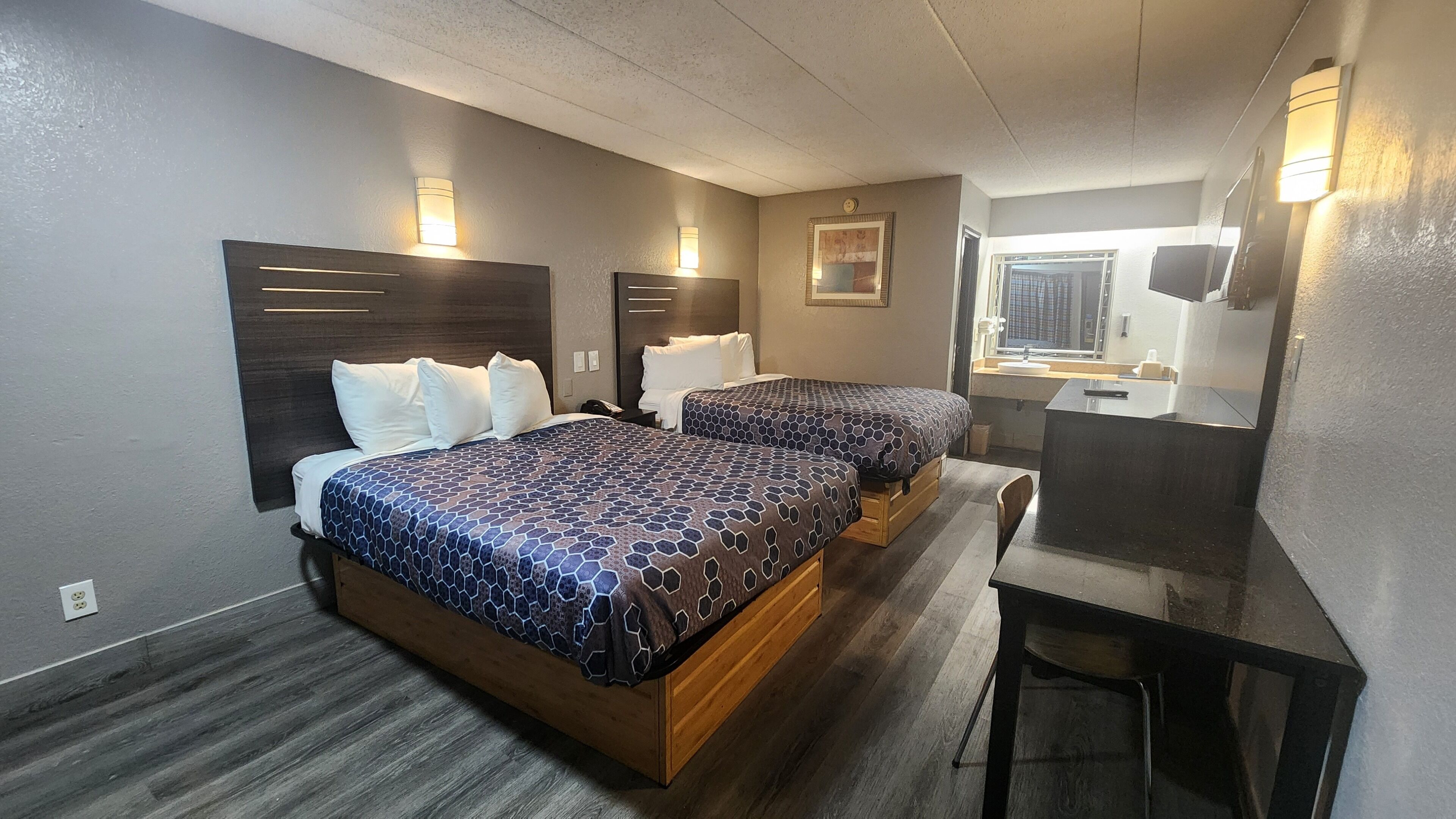 Desk, laptop workspace, blackout drapes, iron/ironing board