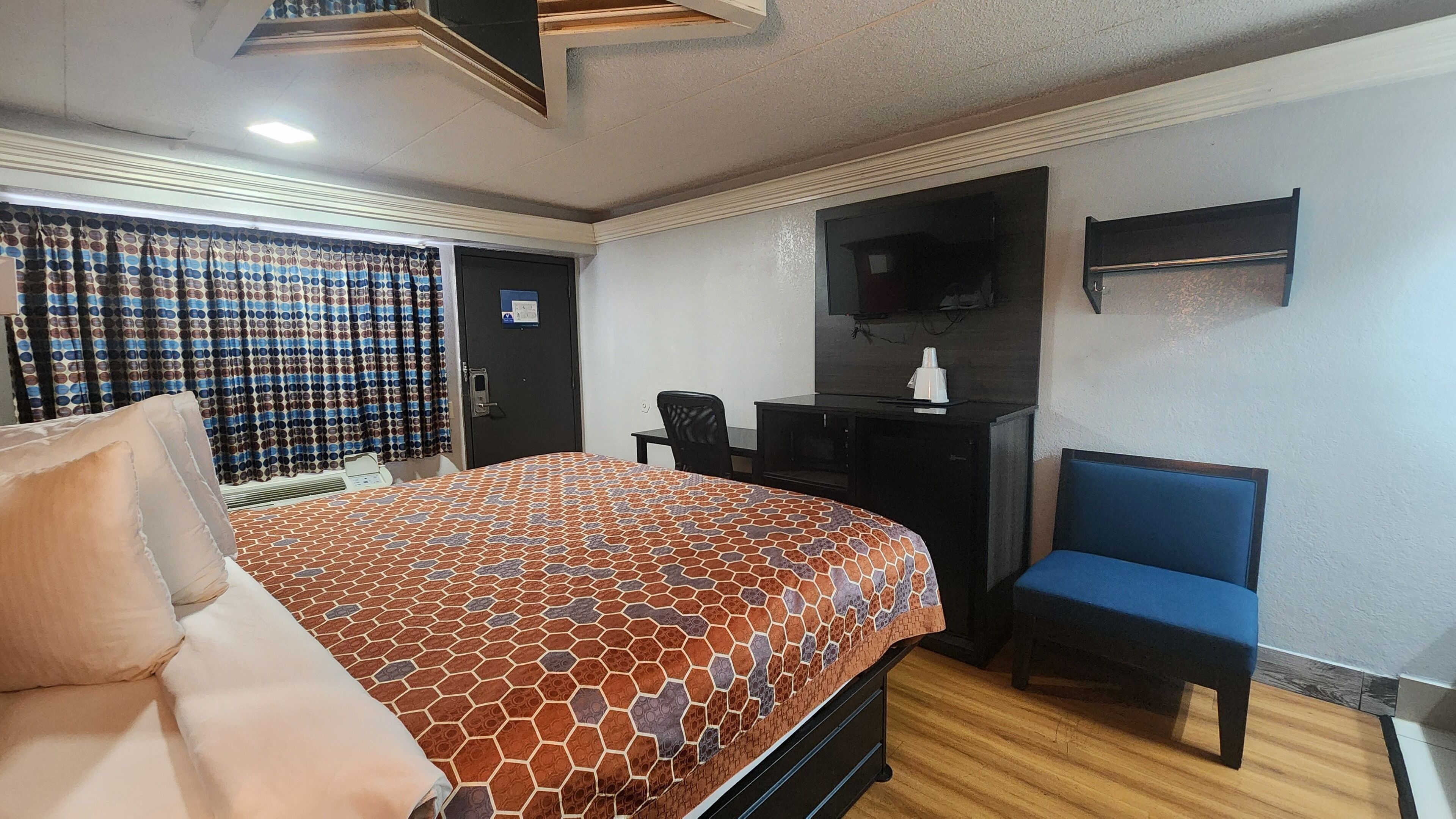 Desk, laptop workspace, blackout curtains, iron/ironing board