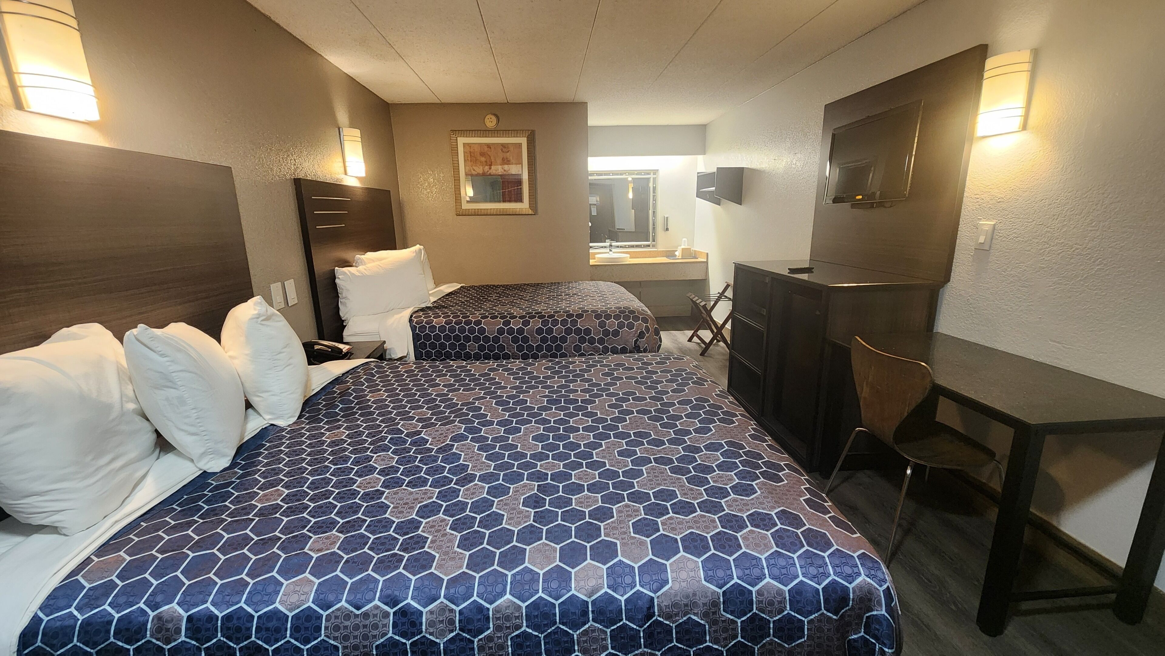 Desk, laptop workspace, blackout drapes, iron/ironing board