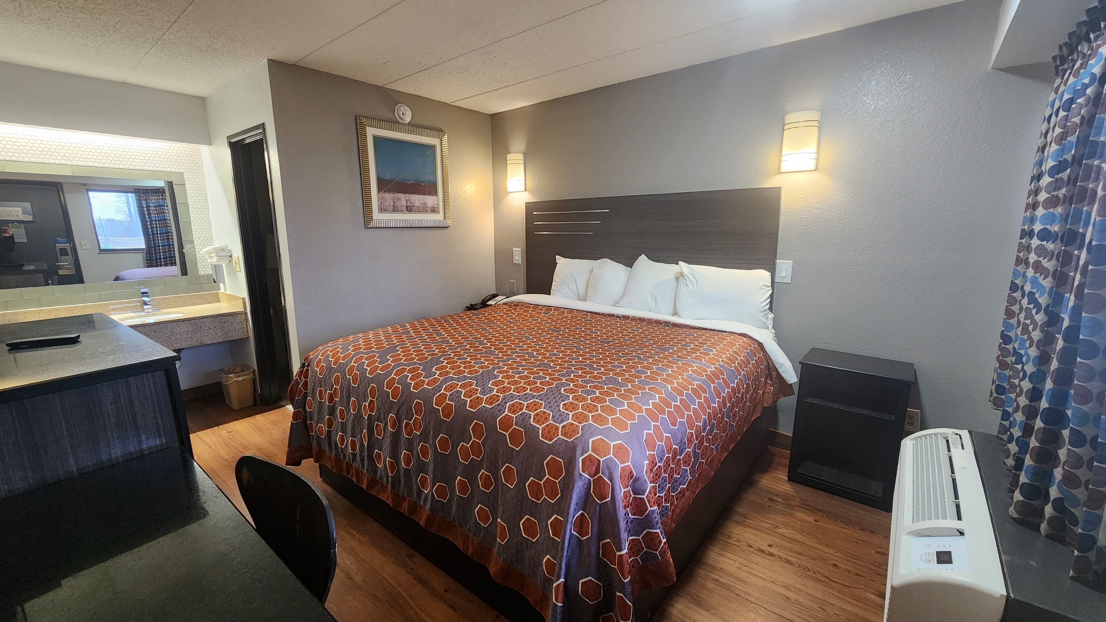 Desk, laptop workspace, blackout drapes, iron/ironing board