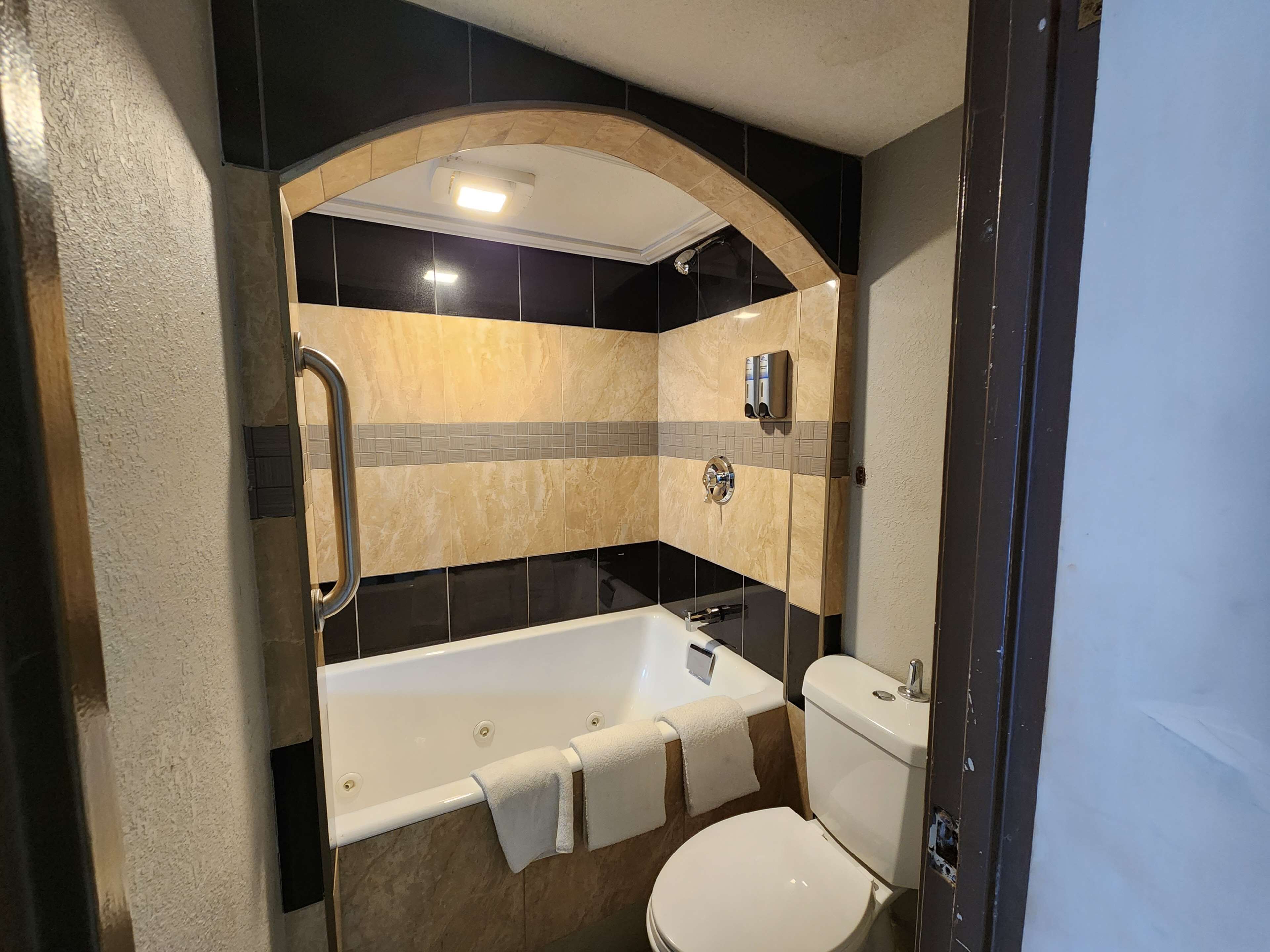 Suite, 1 King Bed, Smoking (Contemporary) | Bathroom | Hair dryer, towels, soap, shampoo