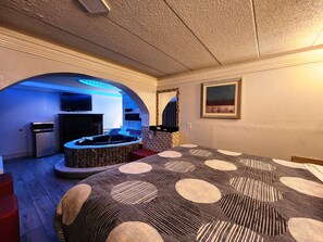 Suite, 1 King Bed, Non Smoking, Jetted Tub | Desk, laptop workspace, blackout drapes, iron/ironing board