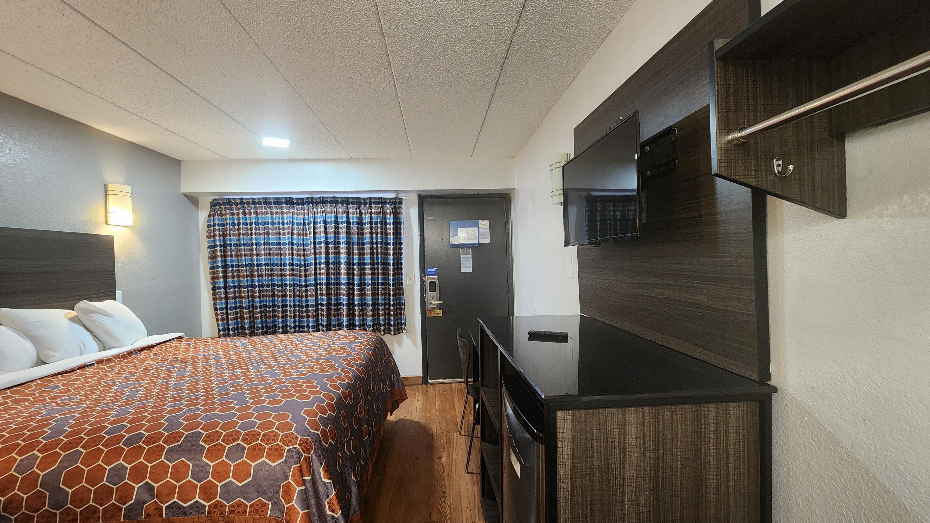 Desk, laptop workspace, blackout drapes, iron/ironing board