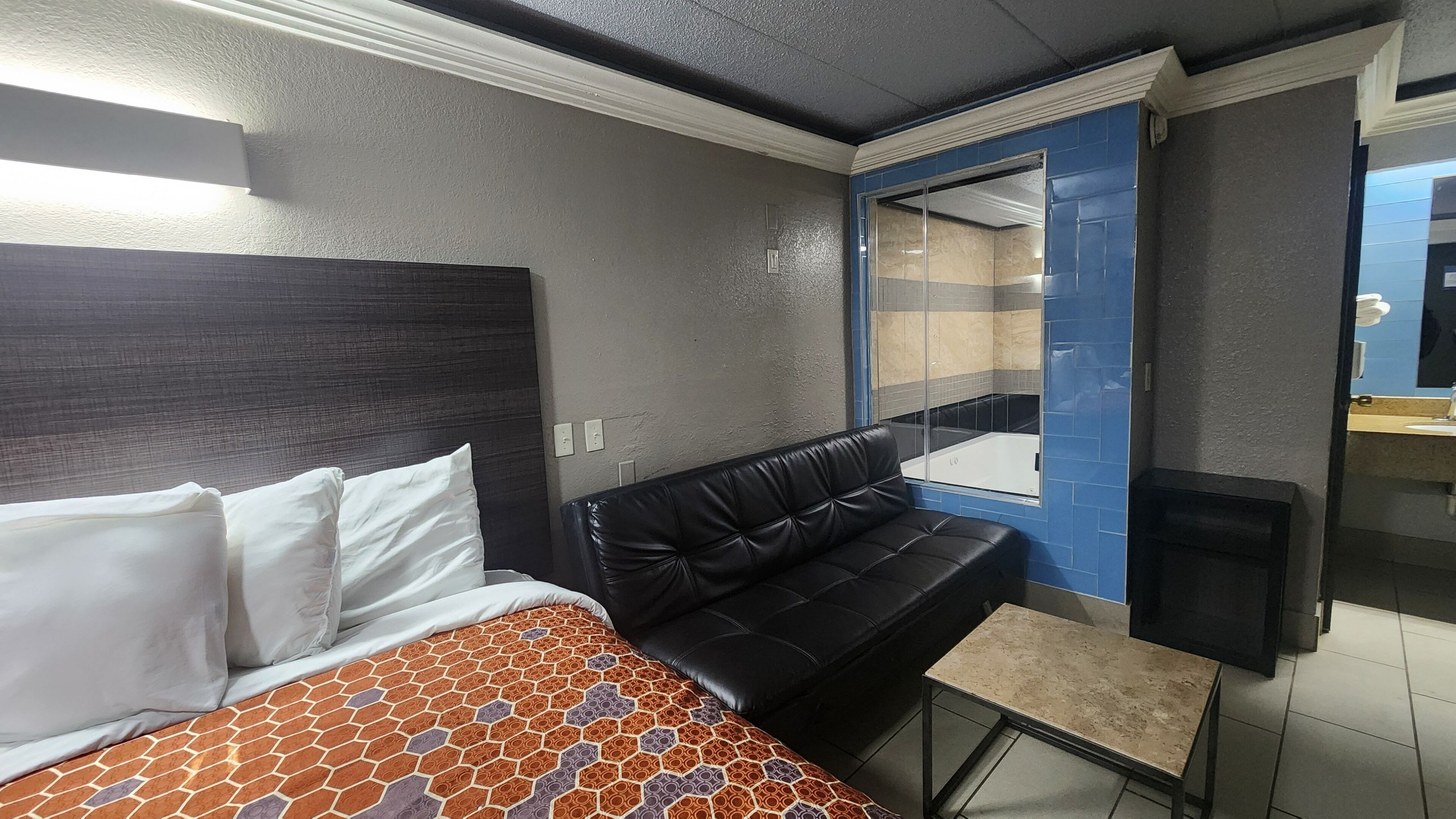 Desk, laptop workspace, blackout drapes, iron/ironing board