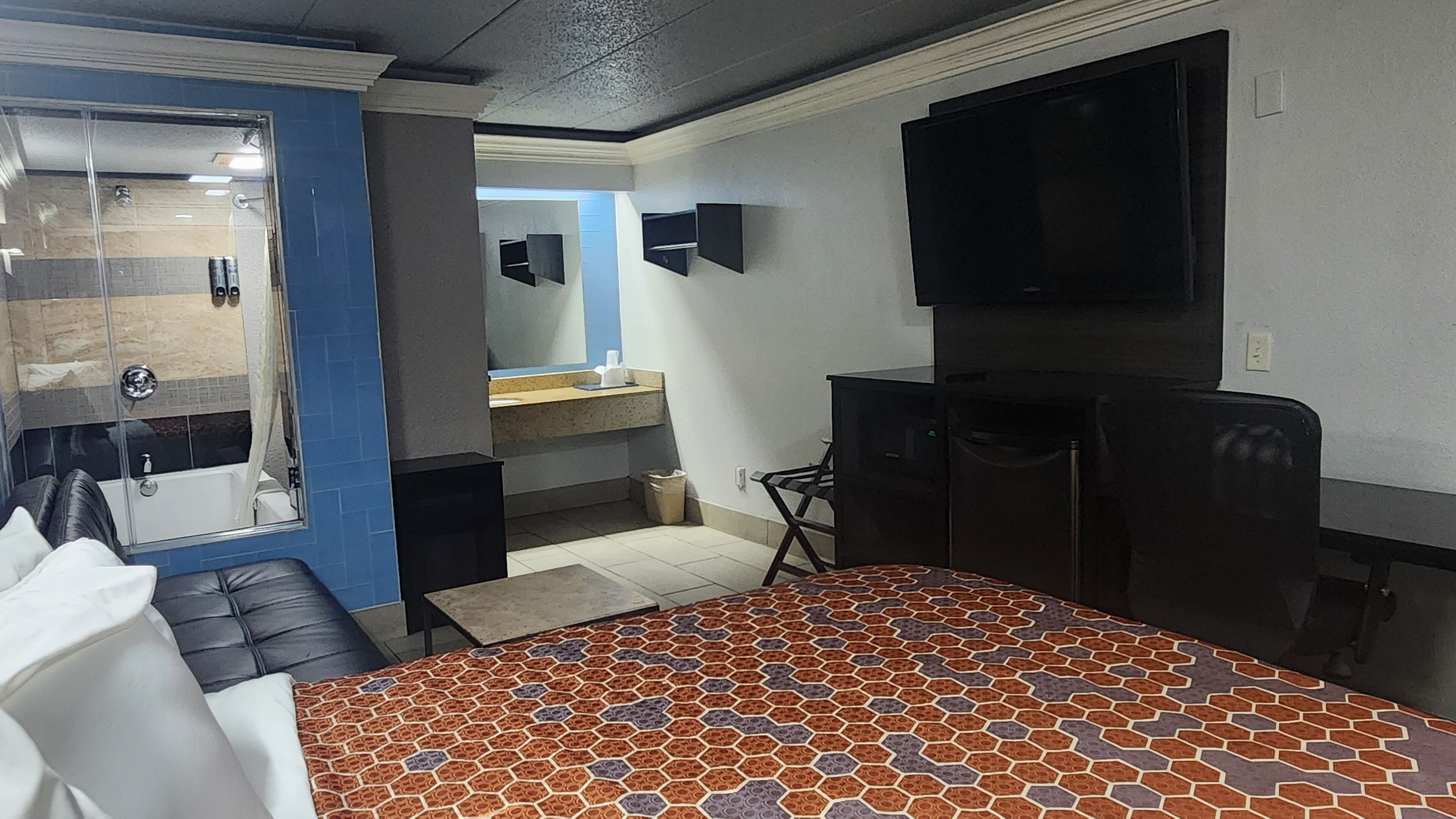 Desk, laptop workspace, blackout drapes, iron/ironing board