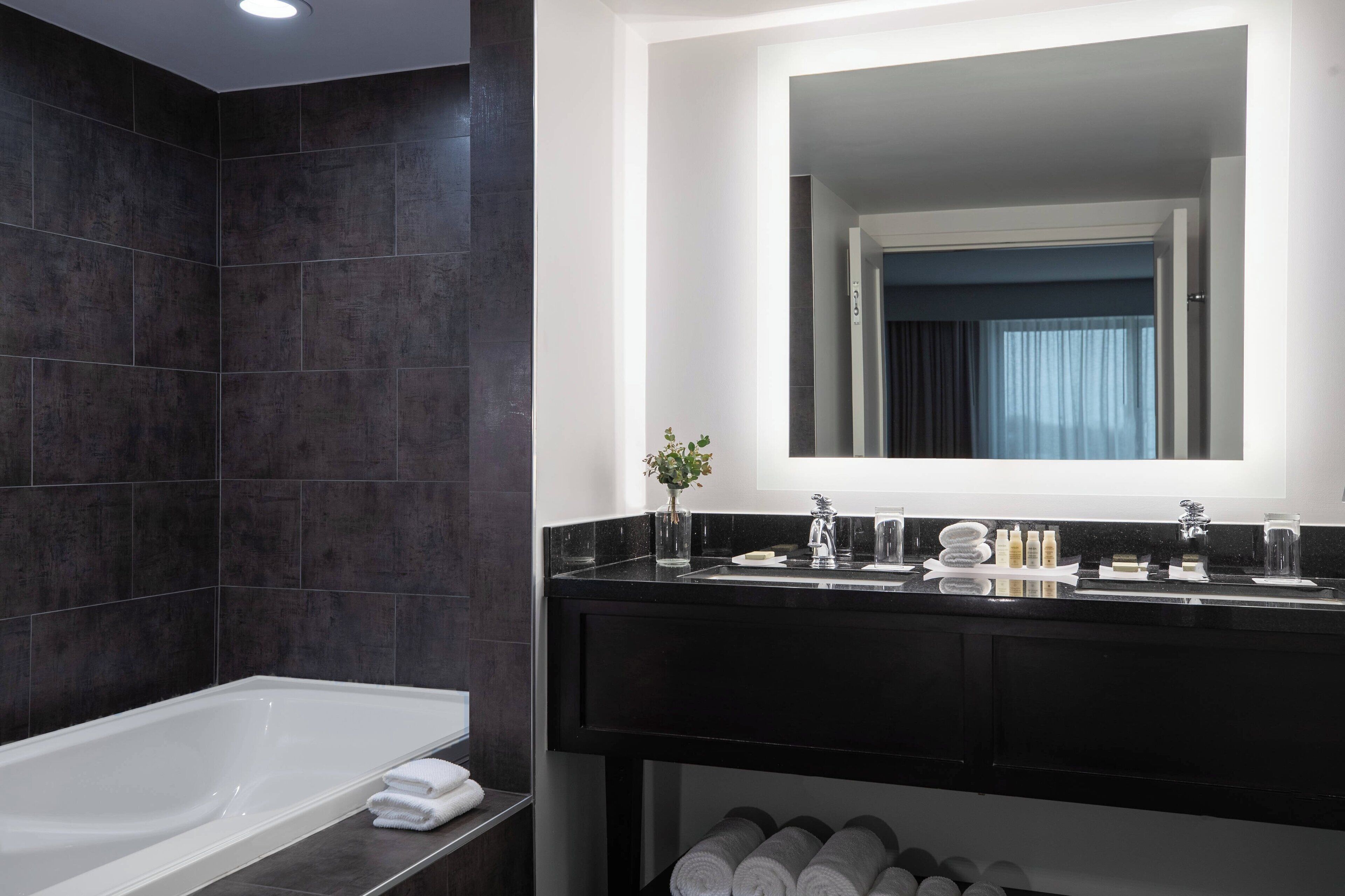 designer toiletries, hair dryer, towels