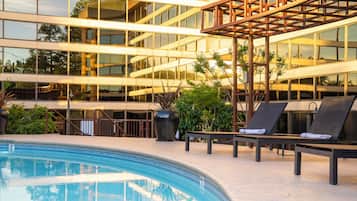 Outdoor pool, open 6:00 AM to 10:00 PM, sun loungers