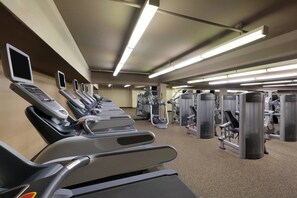 A gym with treadmills, elliptical machines, and weight machines. - Walnut Creek Marriott (Walnut Creek)