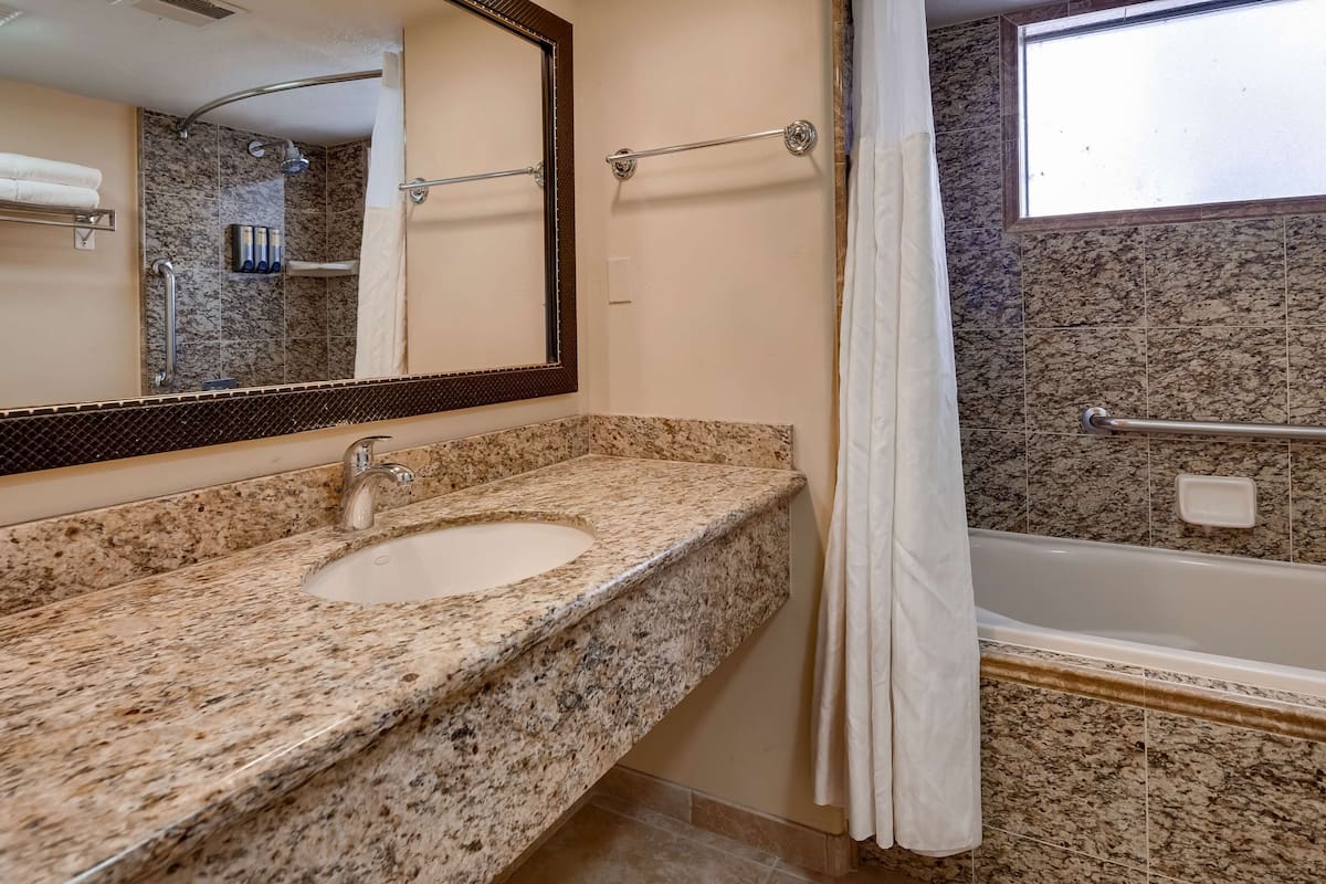 suite, multiple beds, non smoking, fireplace (with sofabed) | bathroom | free toiletries, hair dryer, towels
