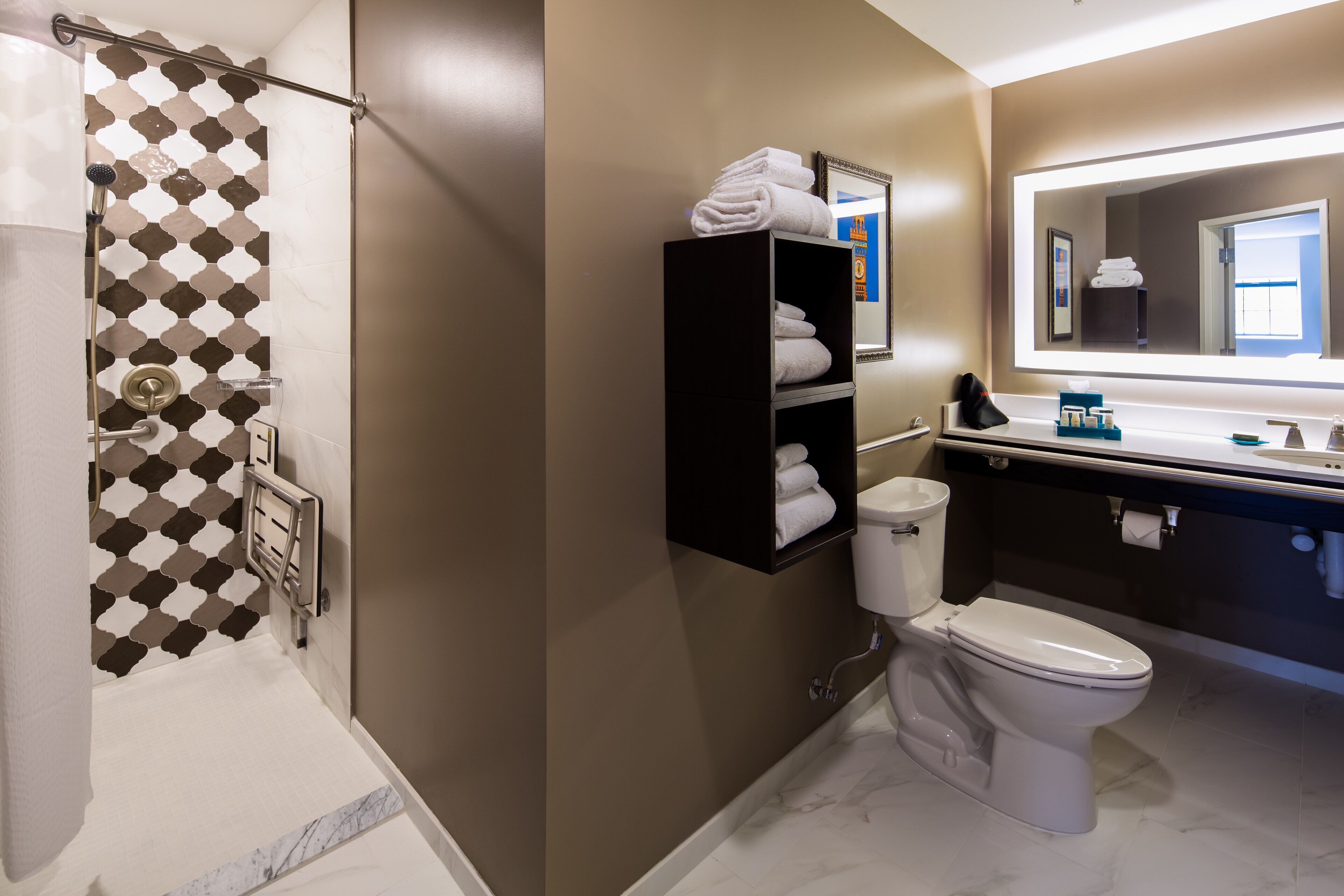 combined shower/bathtub, designer toiletries, hair dryer, towels