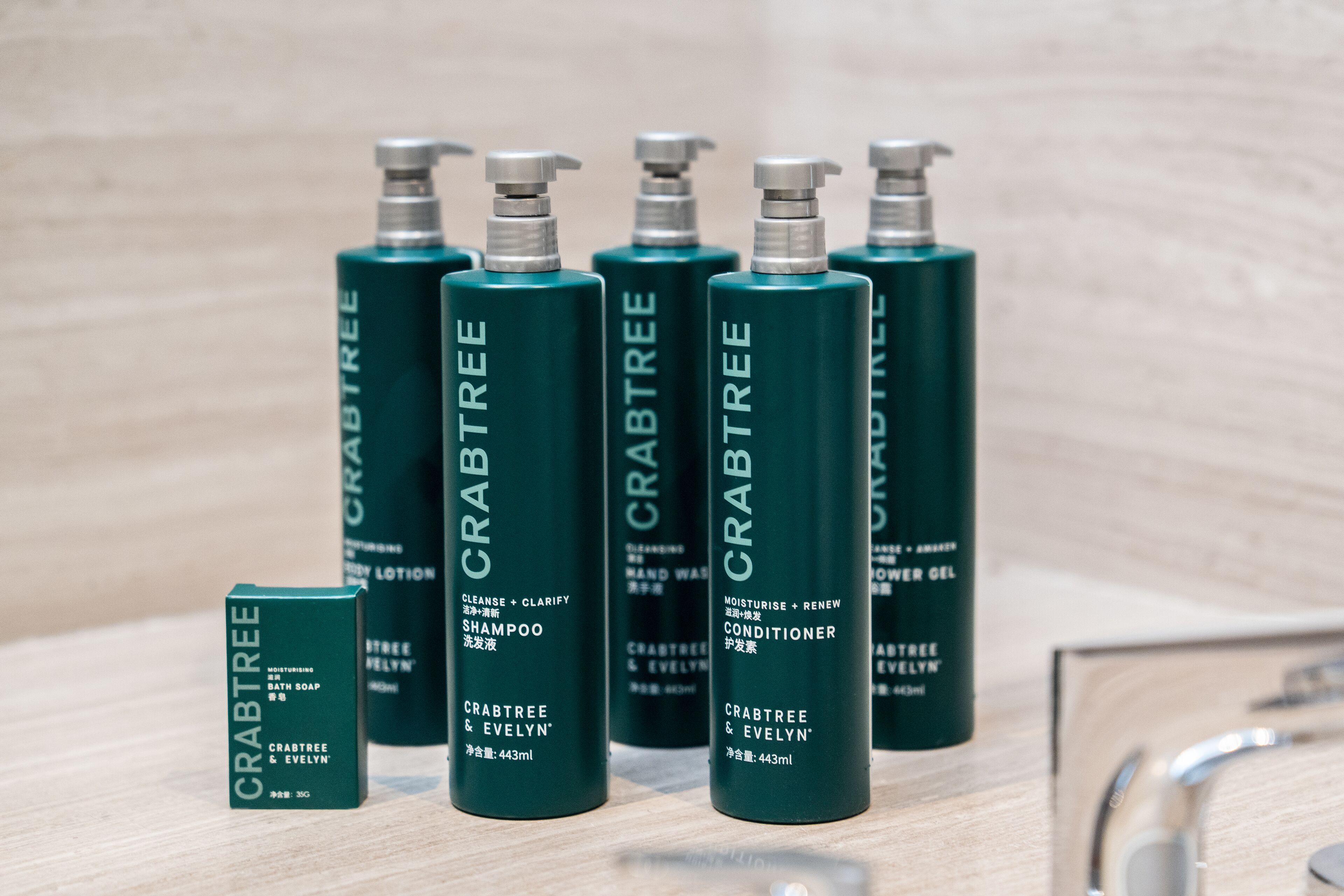 designer toiletries, hair dryer, bathrobes, slippers