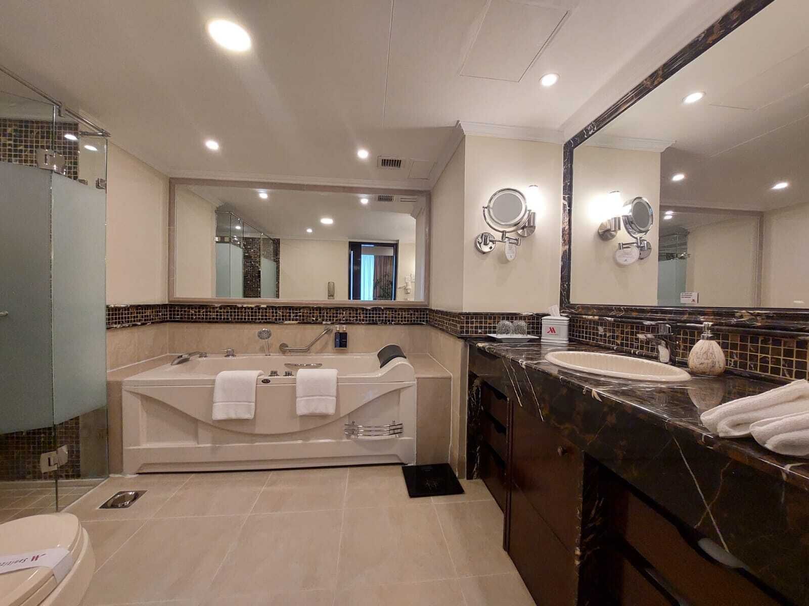 presidential suite, 1 king bed | bathroom | rainfall showerhead, hair dryer, bathrobes, slippers