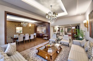 Presidential Suite, 1 King Bed | Living room | Plasma TV