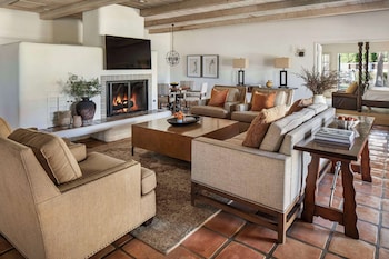 Suite, 1 King Bed with Sofa bed, Fireplace | Living area | 42-inch LCD TV with cable channels, TV at La Quinta Resort & Club, Curio Collection by Hilton