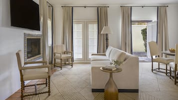 Suite, 1 King Bed, Kitchenette | Living area | 42-inch LCD TV with cable channels, TV