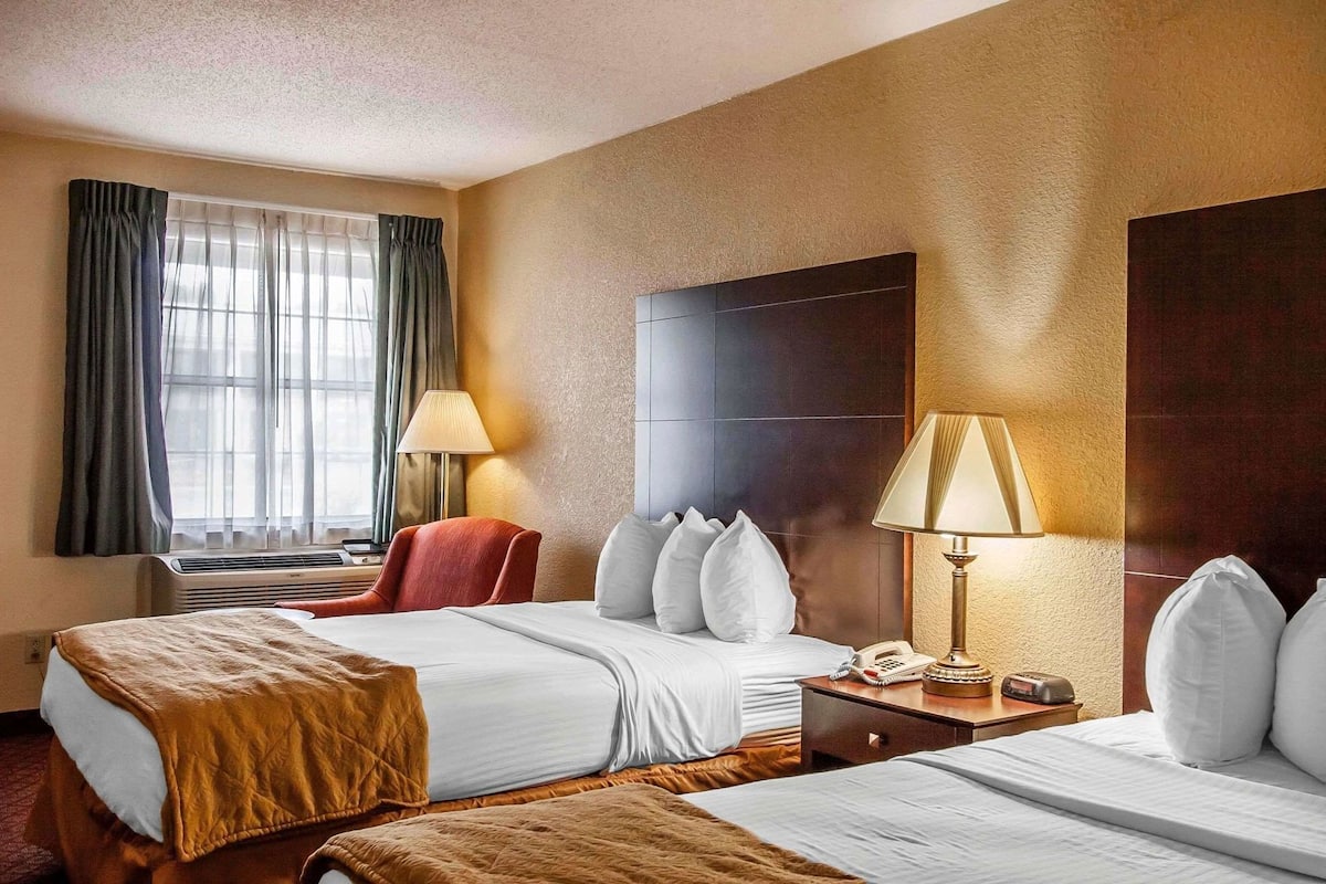 Premium bedding, pillow-top beds, blackout curtains, iron/ironing board