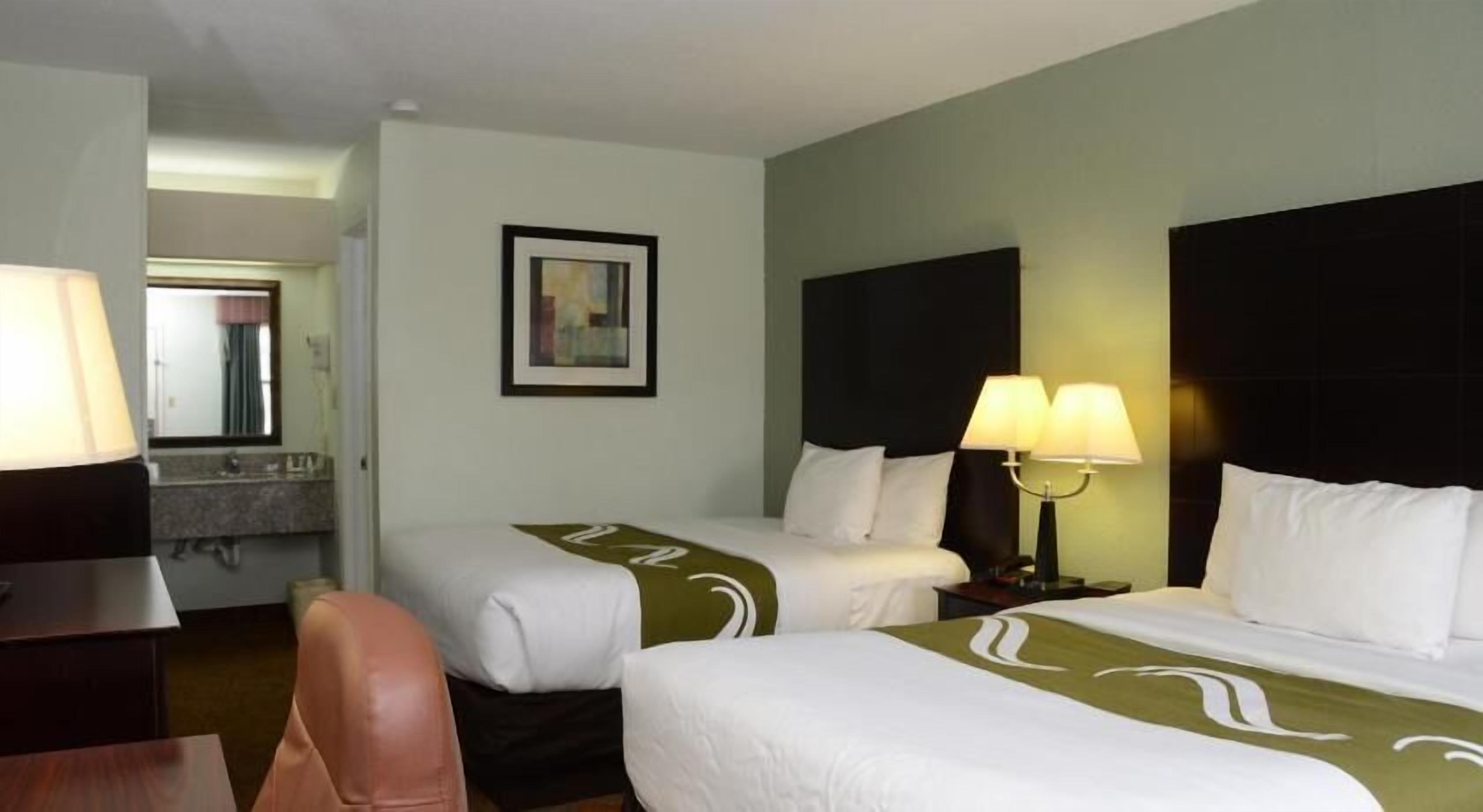 Premium bedding, pillow-top beds, blackout curtains, iron/ironing board