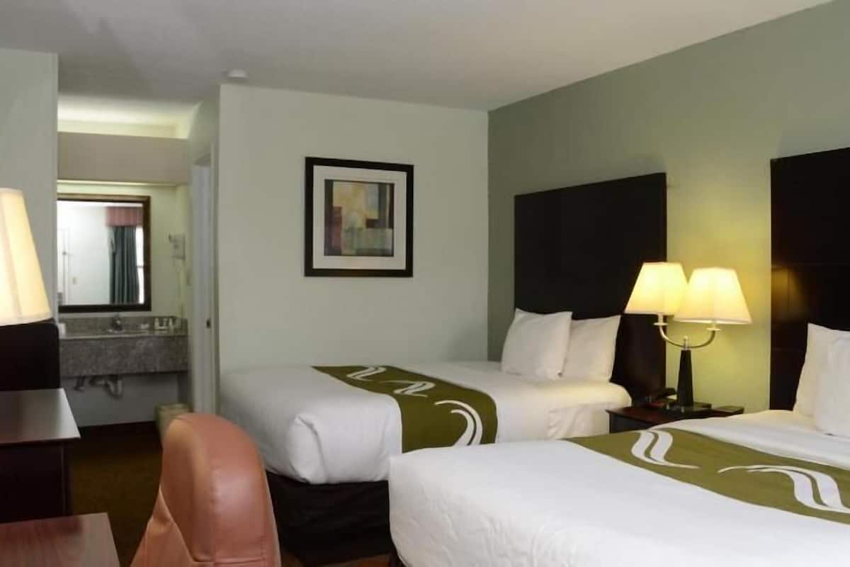 Premium bedding, pillow-top beds, blackout curtains, iron/ironing board