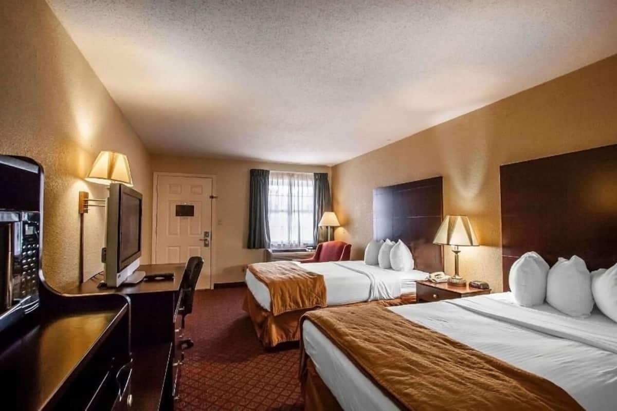 Premium bedding, pillow-top beds, blackout curtains, iron/ironing board