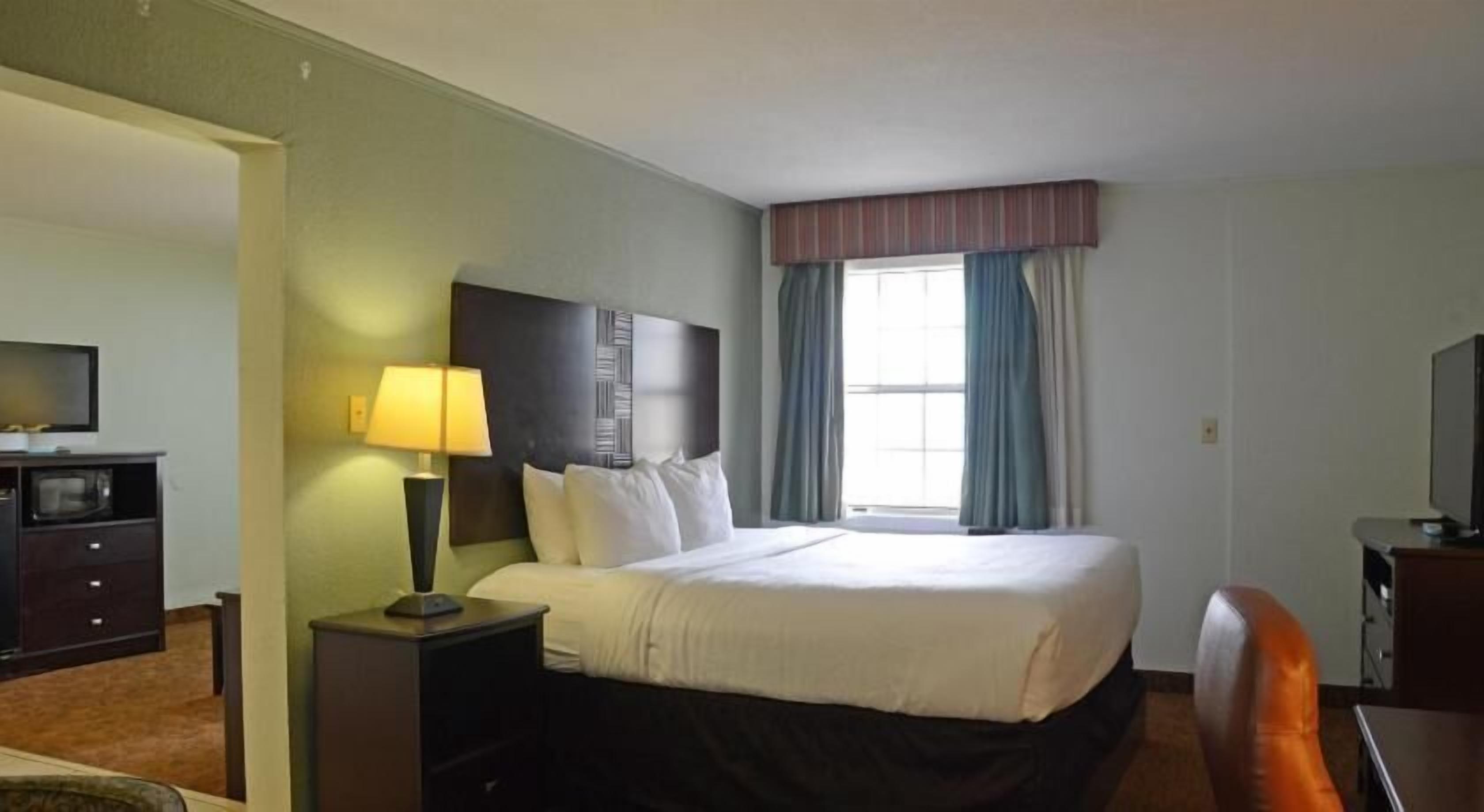 Premium bedding, pillow-top beds, blackout curtains, iron/ironing board