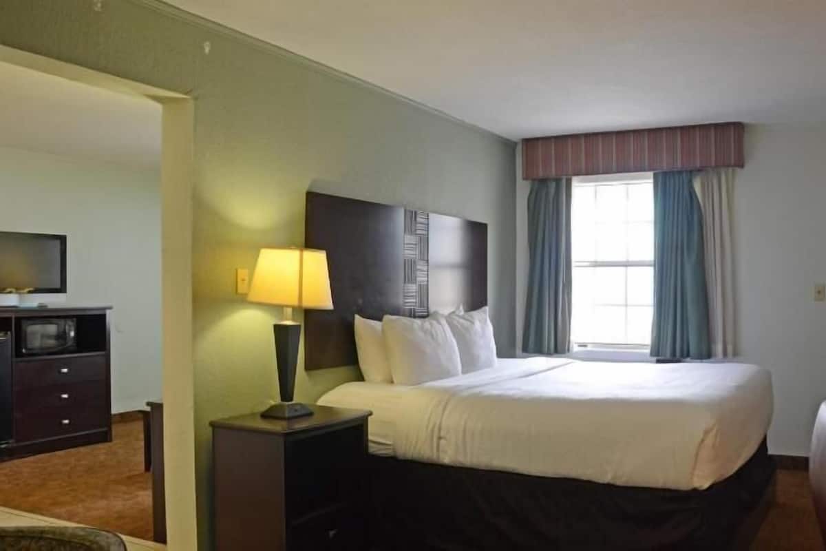 Premium bedding, pillow-top beds, blackout curtains, iron/ironing board