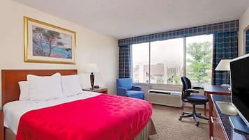 Hypo-allergenic bedding, desk, laptop workspace, blackout drapes