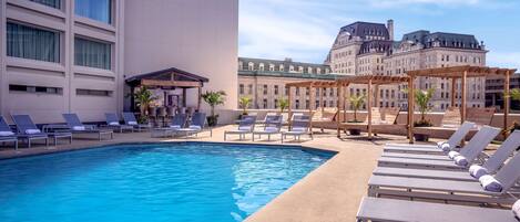 Outdoor pool, a heated pool, sun loungers, lifeguards on site
