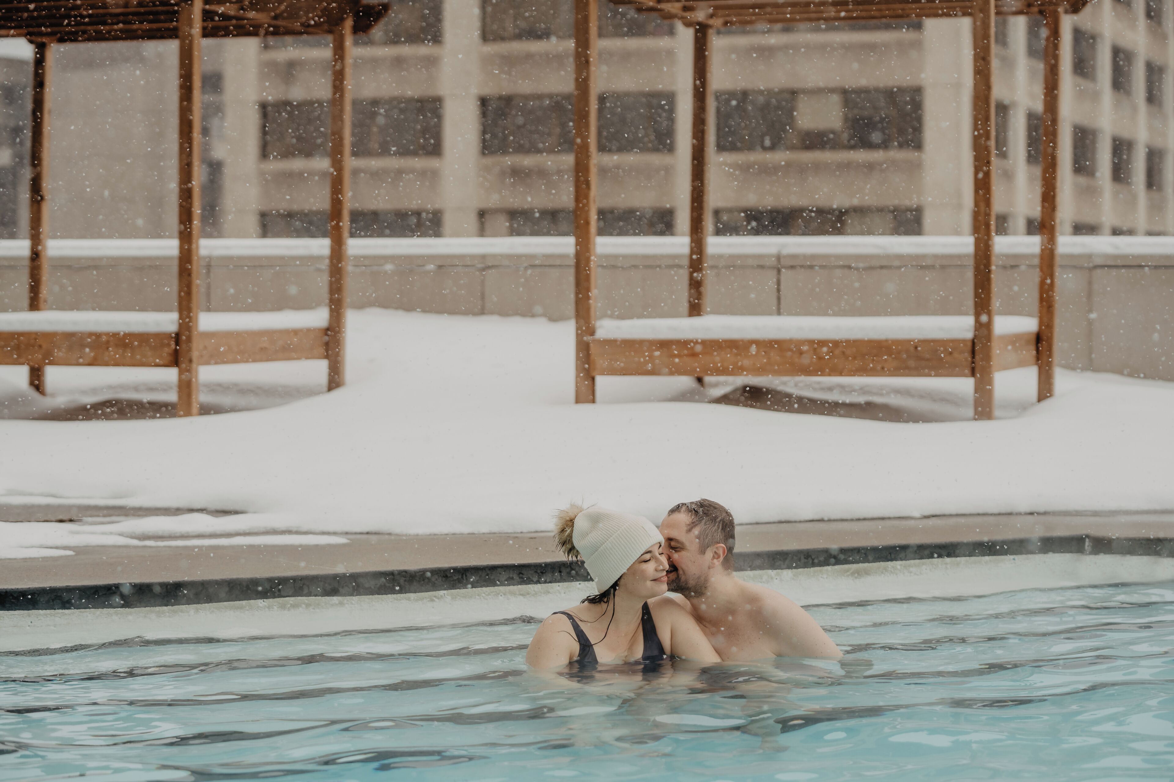 Outdoor pool, a heated pool, pool loungers, lifeguards on site