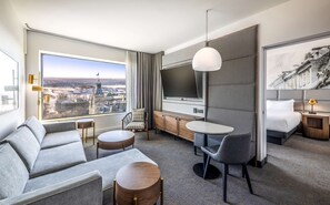 Junior Suite | Living area | 55-inch LCD TV with cable channels, TV, iPod dock - Hilton Quebec (Québec City)