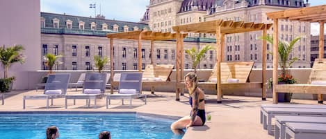 Outdoor pool, a heated pool, sun loungers, lifeguards on site