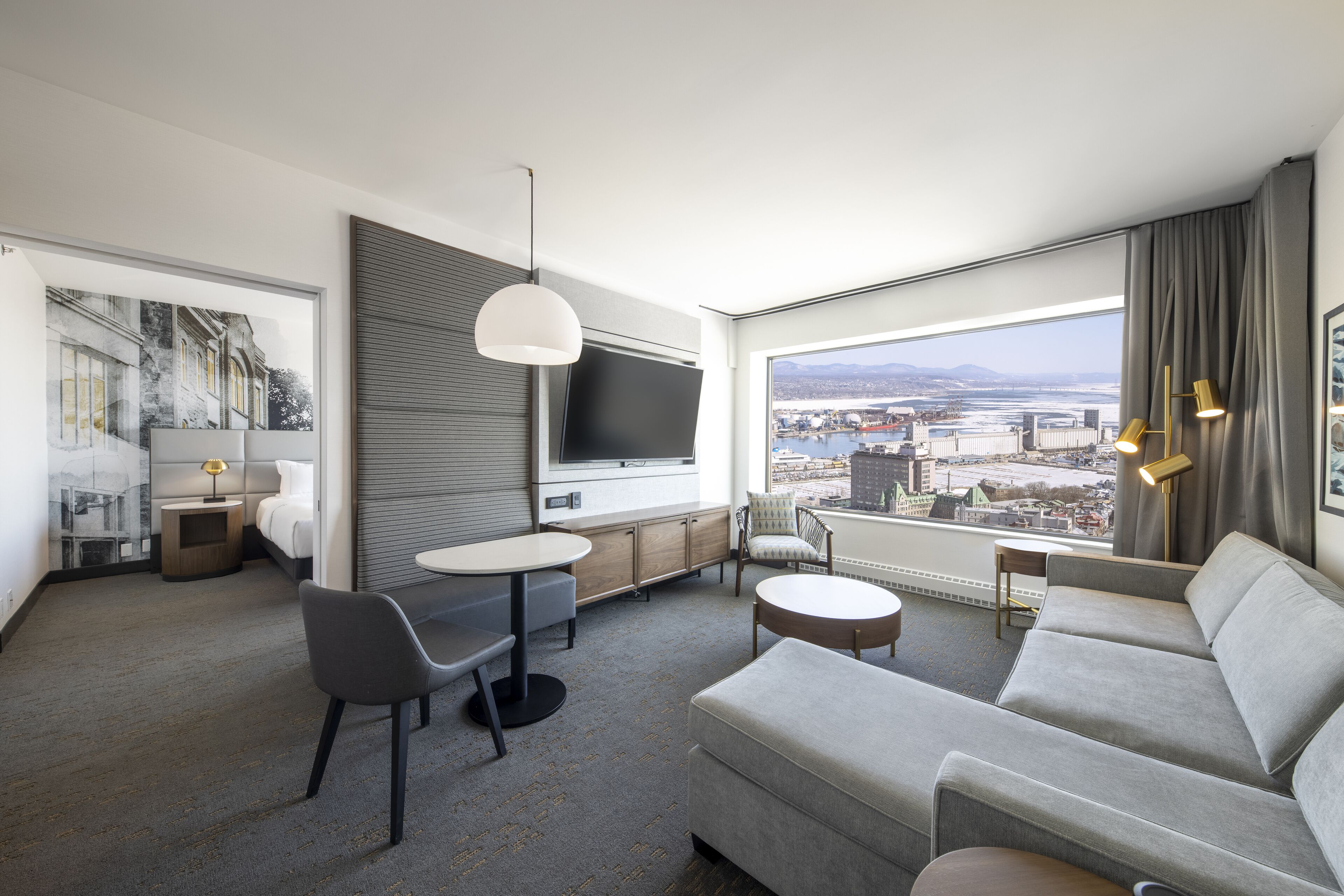 junior suite, 1 king bed, river view | living area | 55-inch lcd tv with cable channels, tv, ipod dock