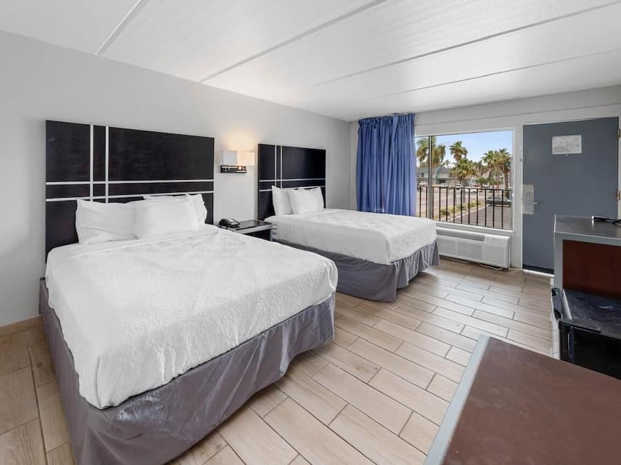 Room, 2 Queen Beds | Individually furnished, desk, laptop workspace, free WiFi