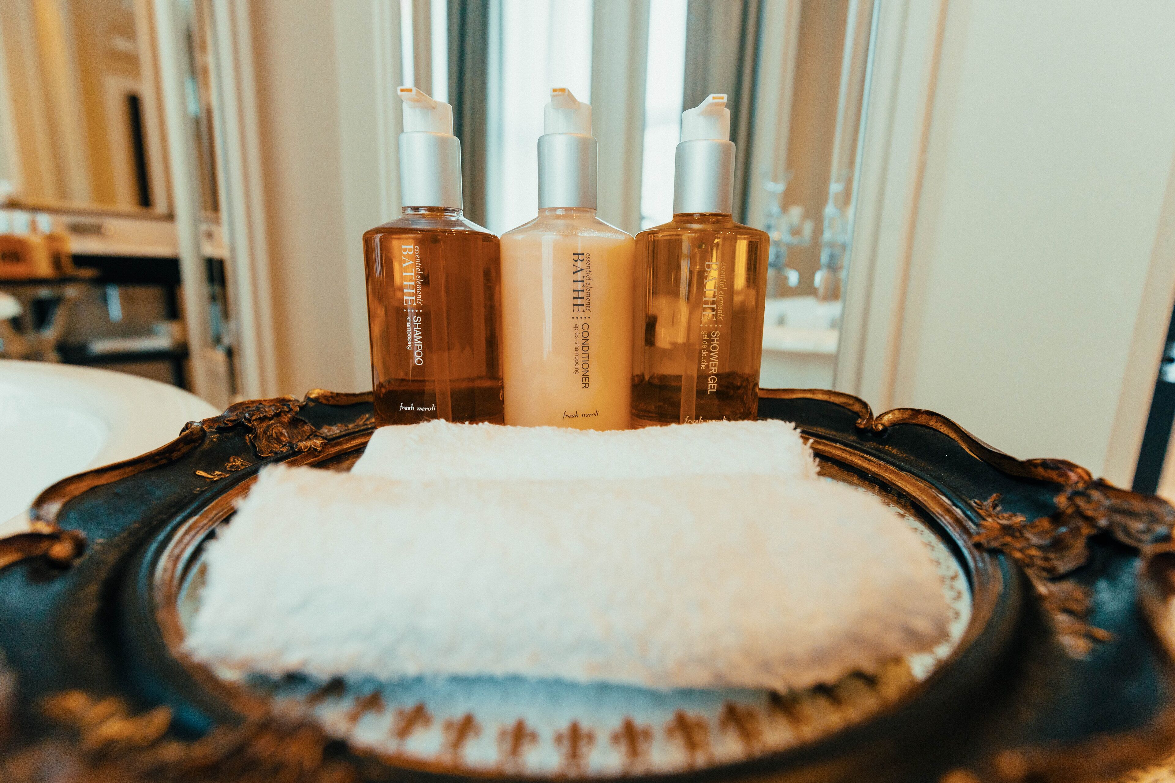 rainfall showerhead, designer toiletries, hair dryer, towels