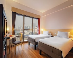 Deluxe Twin Room | Free minibar, desk, laptop workspace, blackout drapes