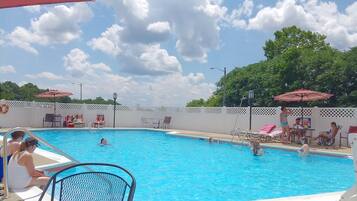Seasonal outdoor pool, open 9:00 AM to 9:00 PM, pool loungers