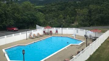 Seasonal outdoor pool, open 9:00 AM to 9:00 PM, sun loungers
