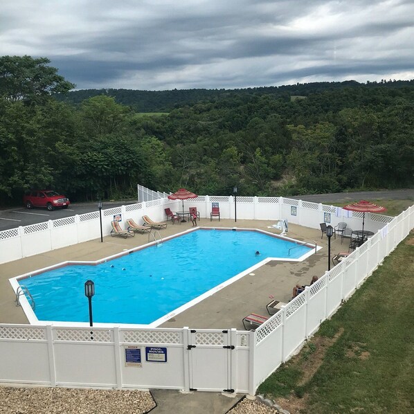 Seasonal outdoor pool, open 9:00 AM to 9:00 PM, sun loungers