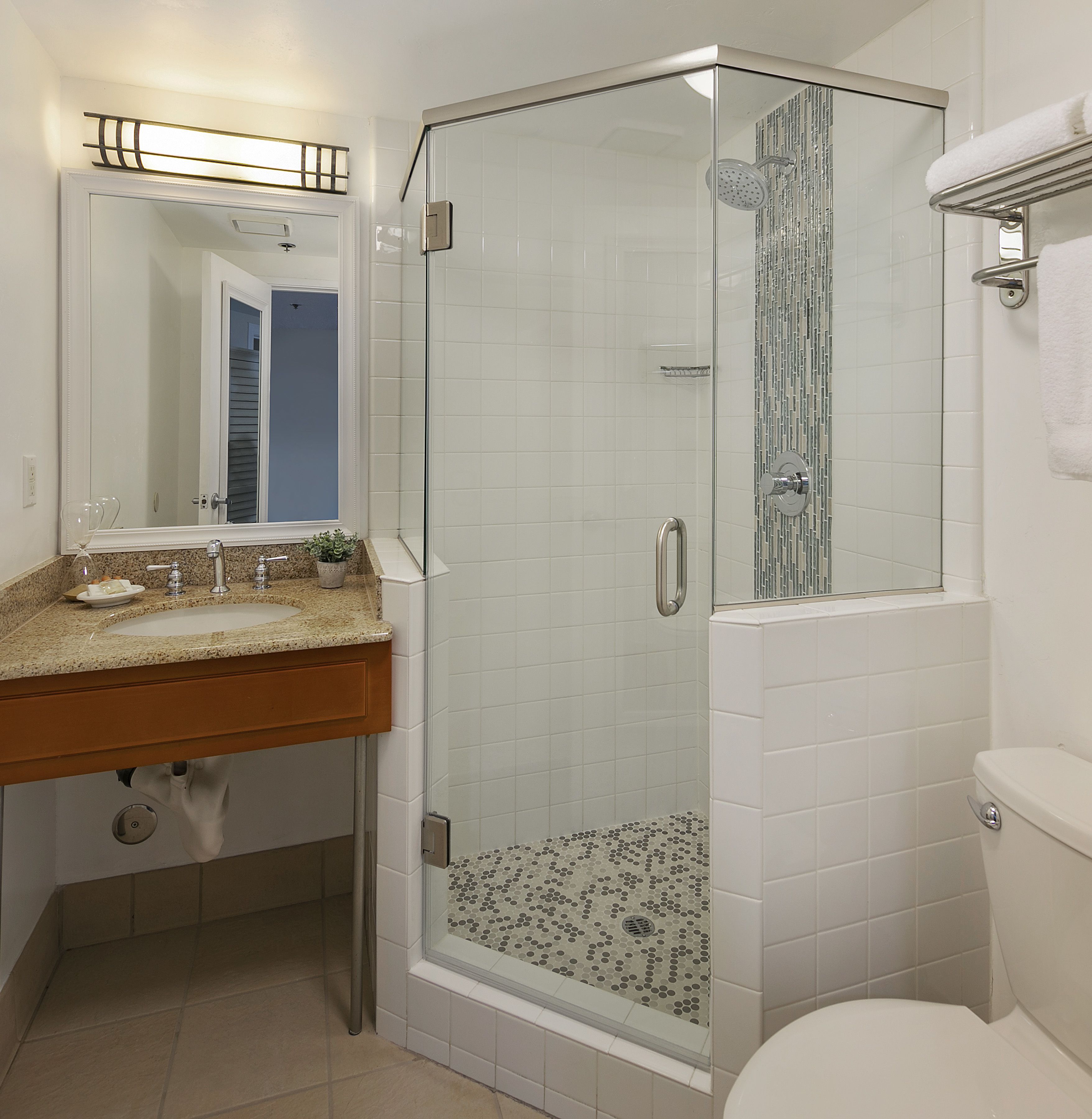combined shower/bathtub, designer toiletries, hair dryer, towels