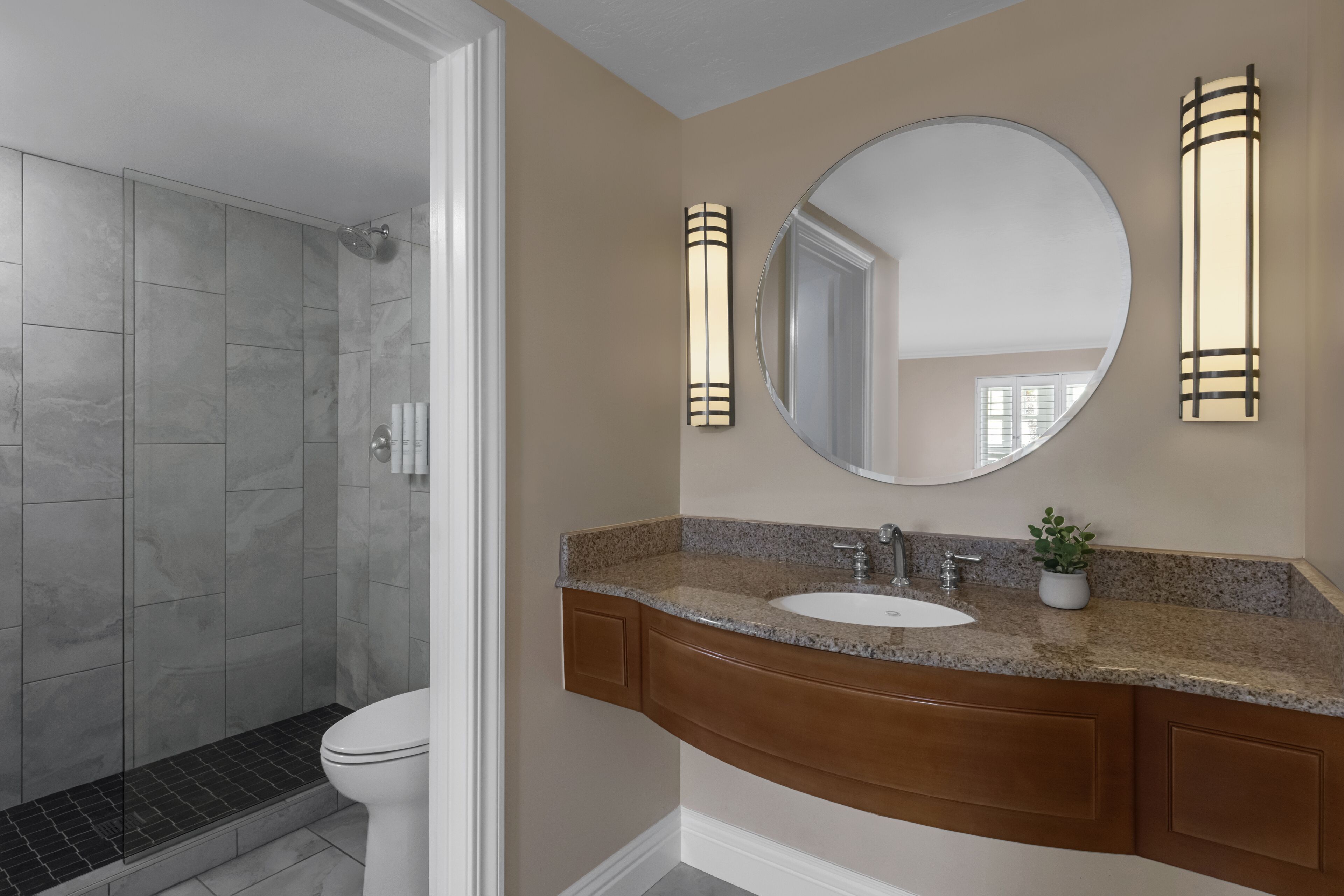 combined shower/bathtub, designer toiletries, hair dryer, towels