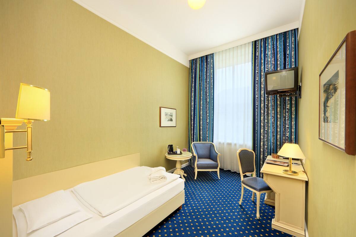 Single Room (small, 12 sqm) | Minibar, in-room safe, desk, blackout drapes