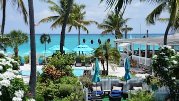 Outdoor pool, open 7 AM to 10 PM, pool umbrellas, pool loungers