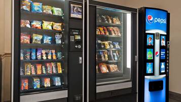 Two vending machines with snacks and a Pepsi dispenser.