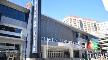 A Times Union Center building with a modern architectural design, featuring large glass windows and a prominent entrance.