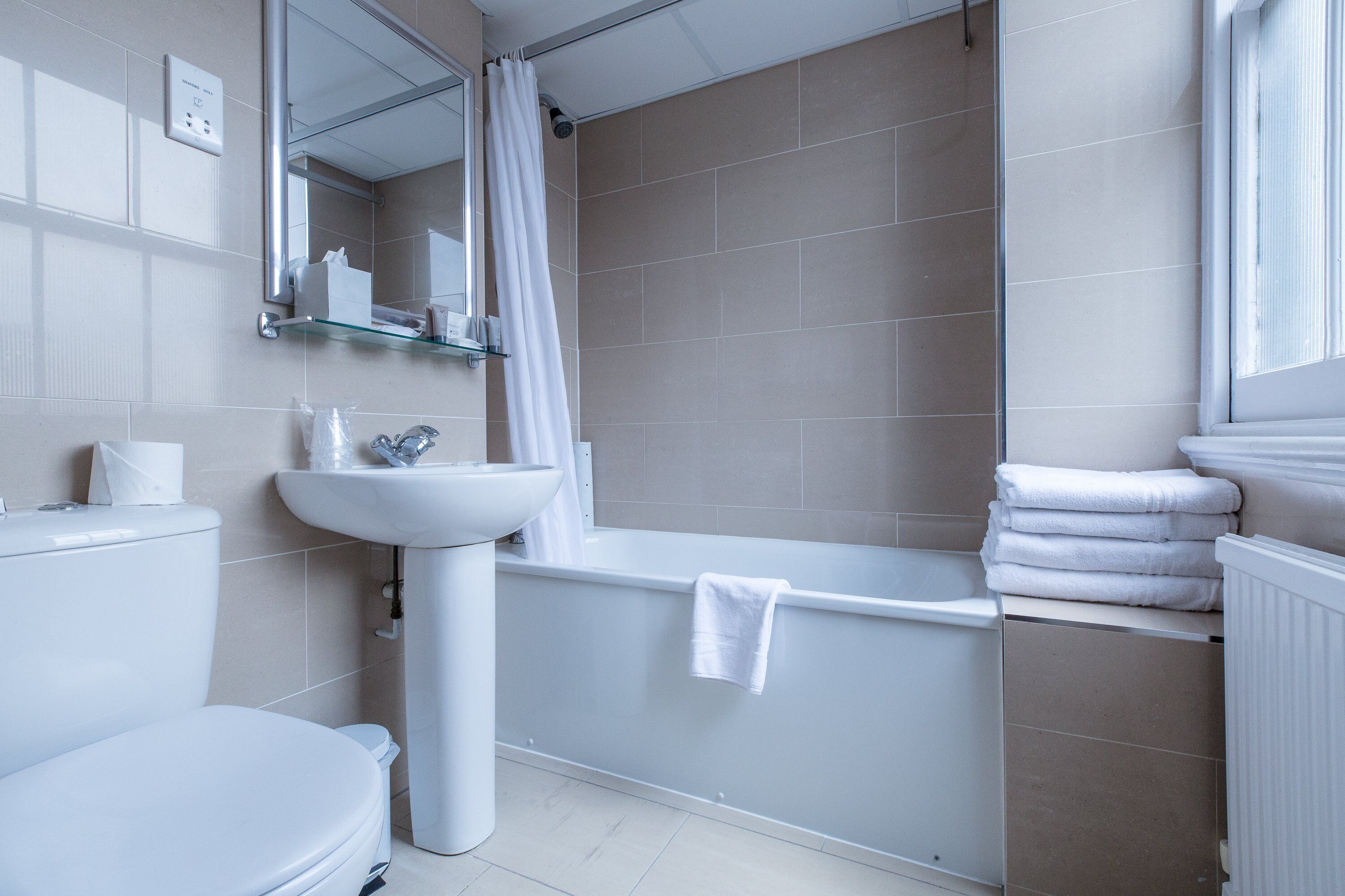 shower, free toiletries, hair dryer, towels