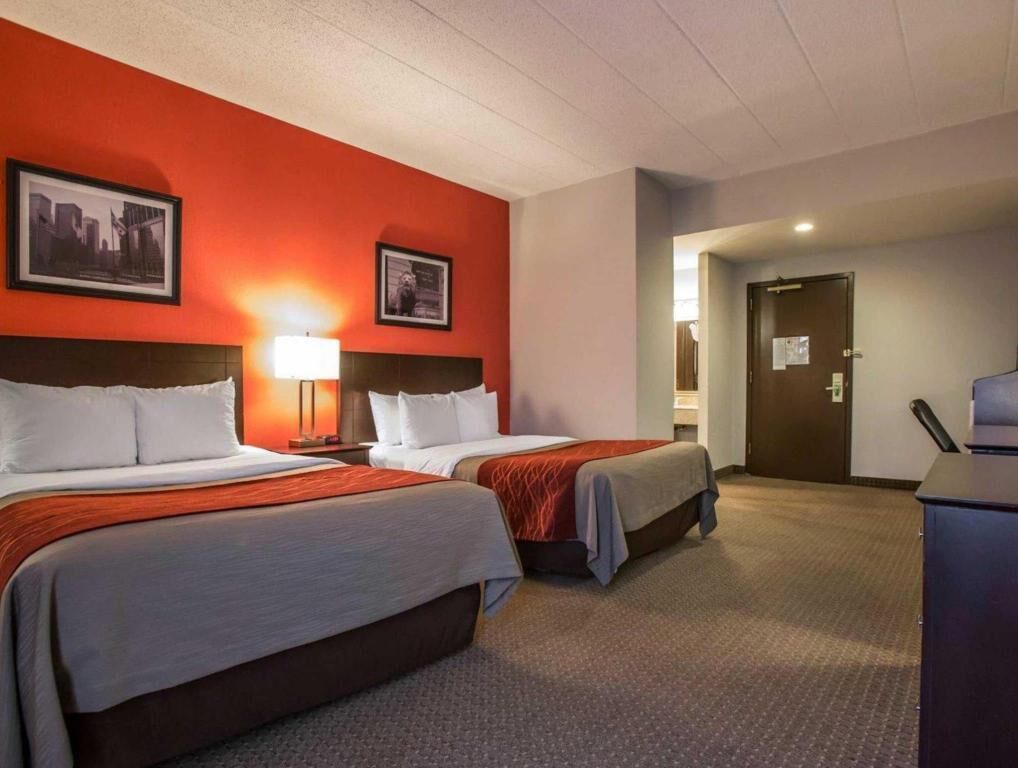 Premium bedding, desk, laptop workspace, blackout drapes