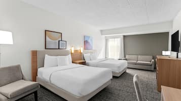 Premium bedding, desk, laptop workspace, blackout curtains