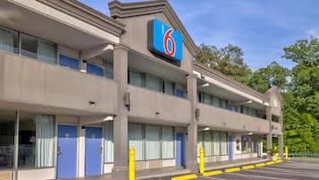Welcome to the 6 Motel, featuring a central entrance and double-hung windows.