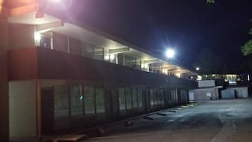 A building with a flat roof and large windows, likely a hotel or office building.