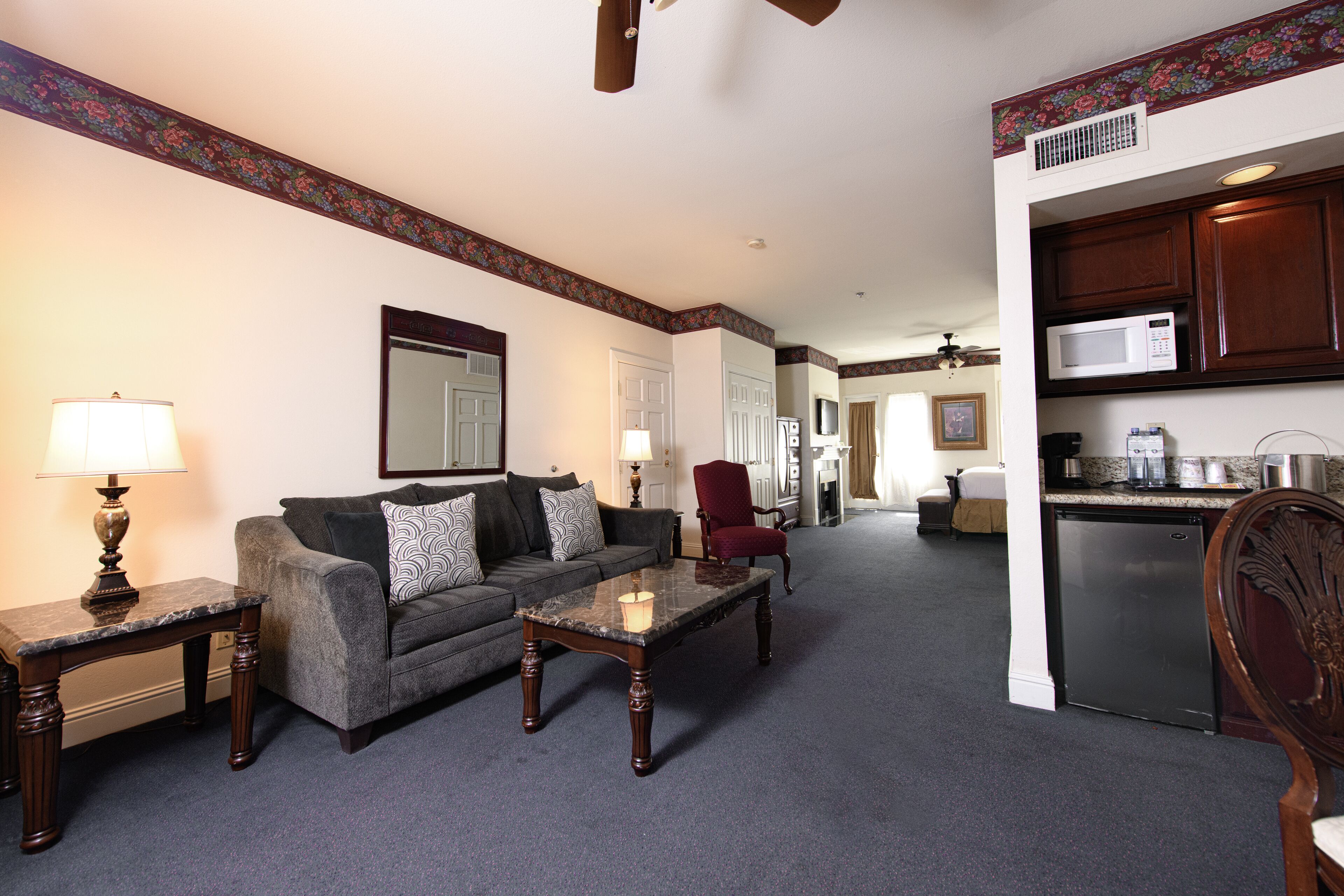 suite, 1 king bed with sofa bed, balcony, city view | living area | fireplace