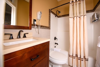 Room, 1 King Bed, Balcony, City View | Bathroom | Combined shower/tub, free toiletries, hair dryer, towels at The Horton Grand, Downtown/Gaslamp Quarter